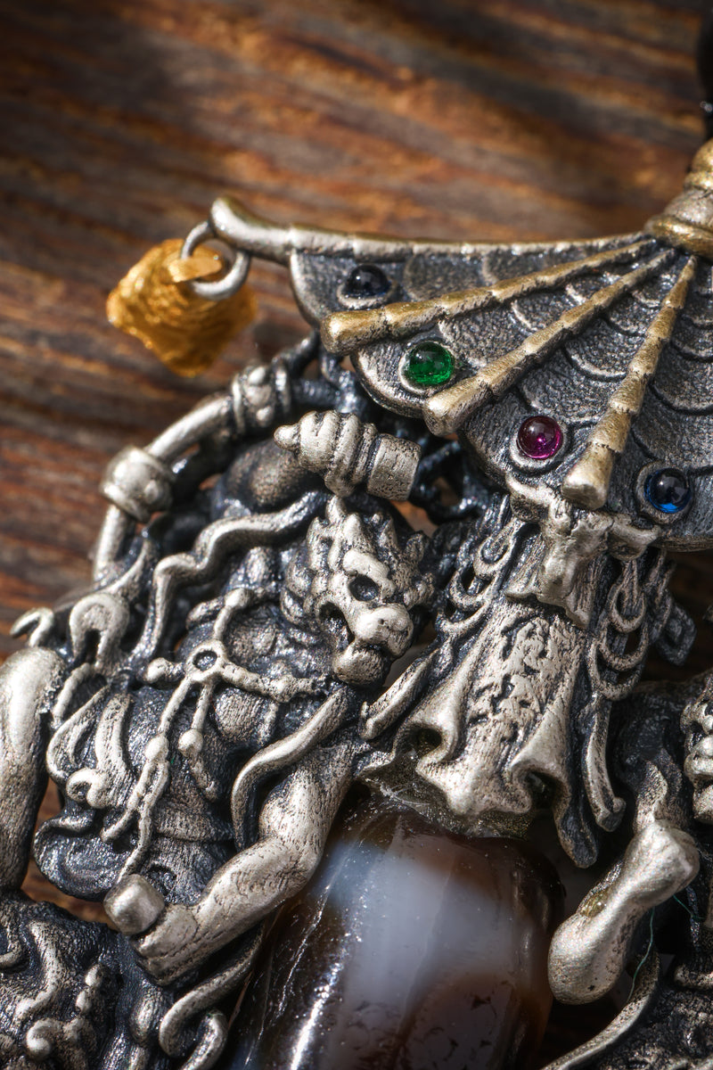 An etched dzi bead set in silver