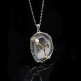 Aries crystal geode zodiac pendant with Aries symbol, angled view