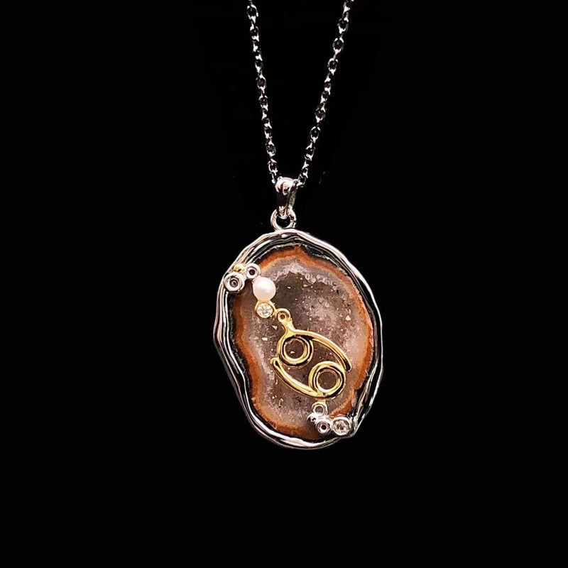 Cancer crystal geode zodiac pendant with Cancer symbol, front view