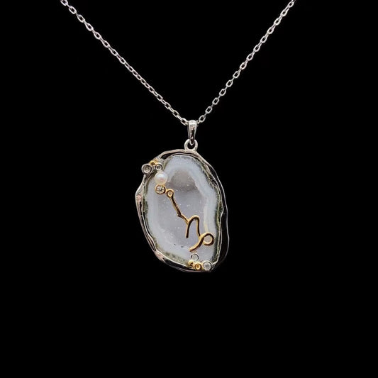 Capricorn crystal geode zodiac pendant with Capricorn symbol, front view