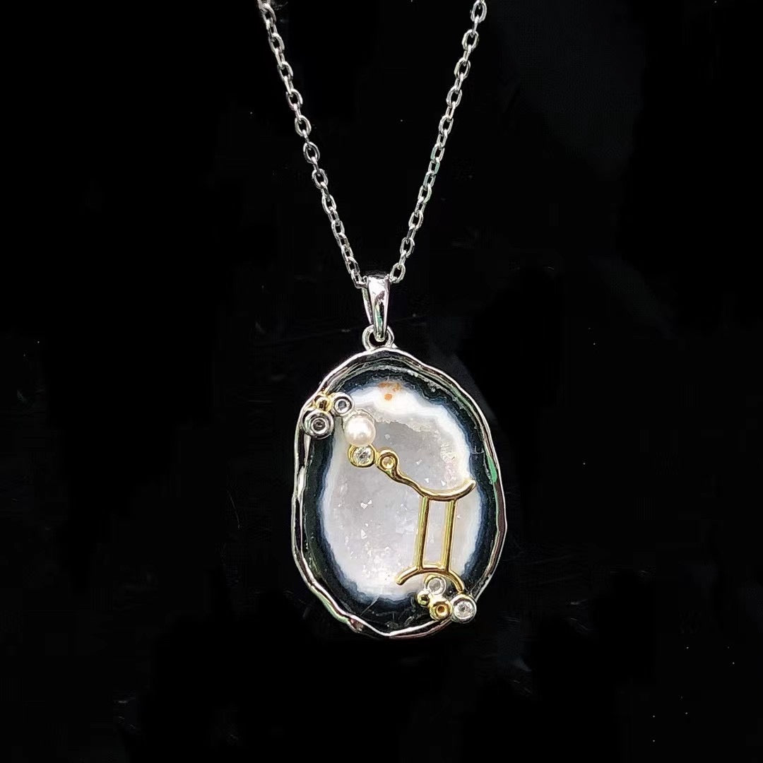Gemini crystal geode zodiac pendant with Gemini symbol, front view