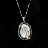 Gemini crystal geode zodiac pendant with Gemini symbol, front view