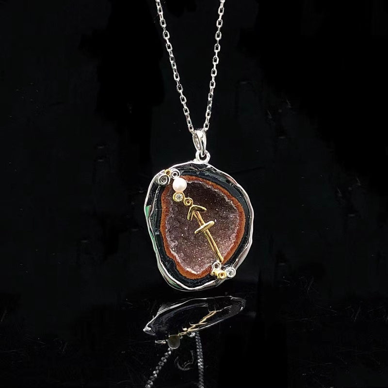 Sagittarius crystal geode zodiac pendant with Sagittarius symbol, front view