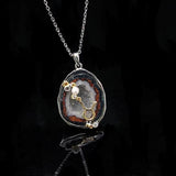Taurus crystal geode zodiac pendant with Taurus symbol, front view