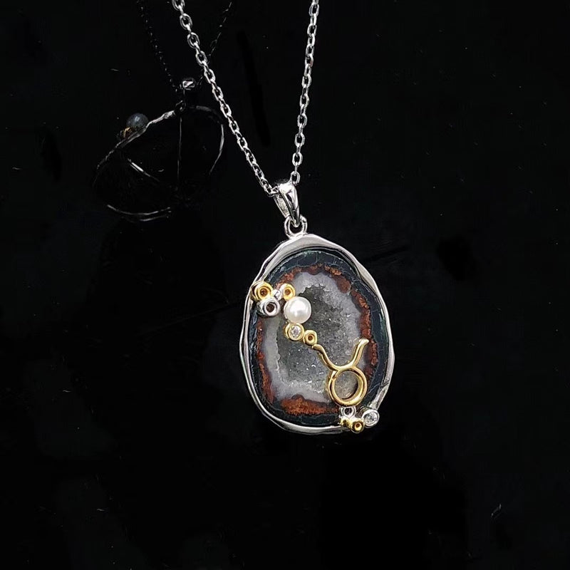 Taurus crystal geode zodiac pendant with Taurus symbol, angled view