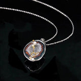Taurus crystal geode zodiac pendant with Taurus symbol, angled view