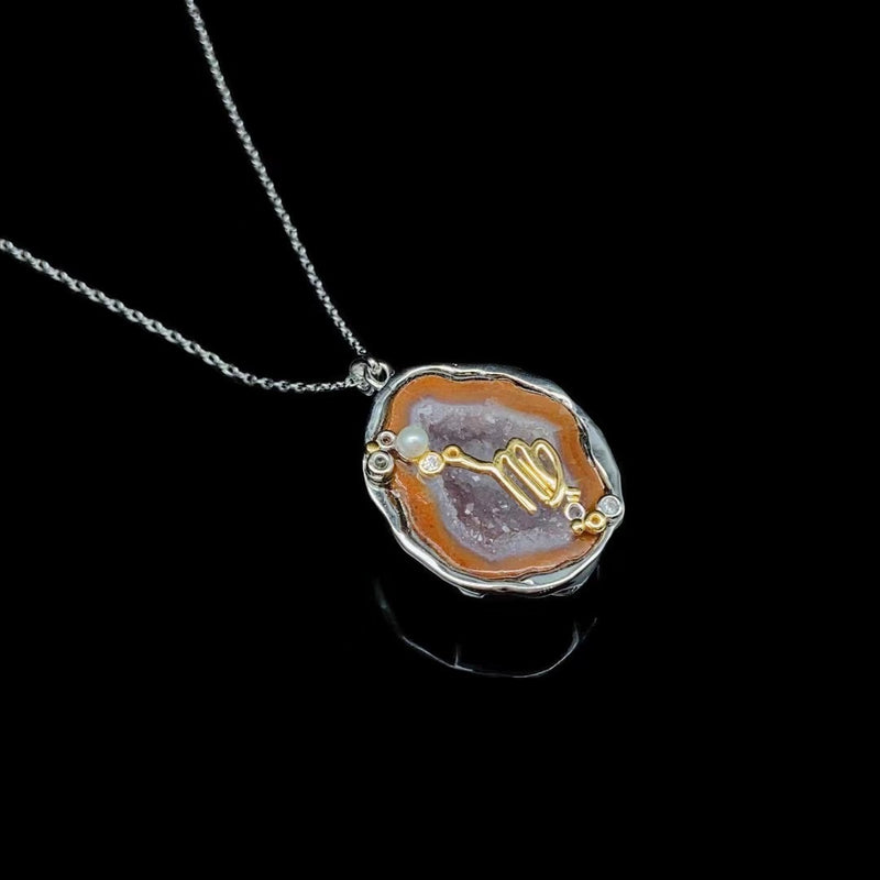 Virgo crystal geode zodiac pendant with Virgo symbol, angled view