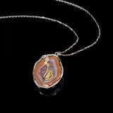 Virgo crystal geode zodiac pendant with Virgo symbol, angled view